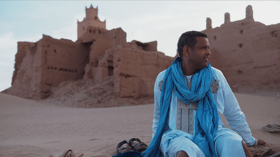 A man sitting in the desert